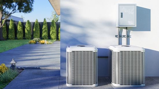 ac & furnace units on side of home