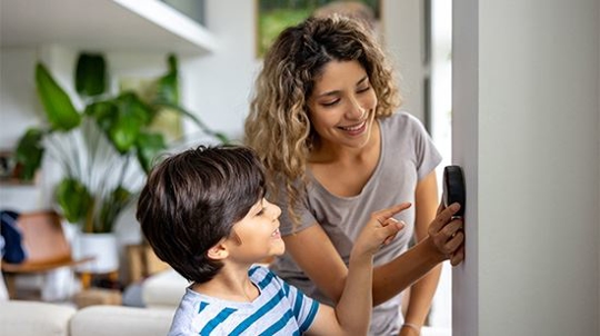 mother and son setting ac temp