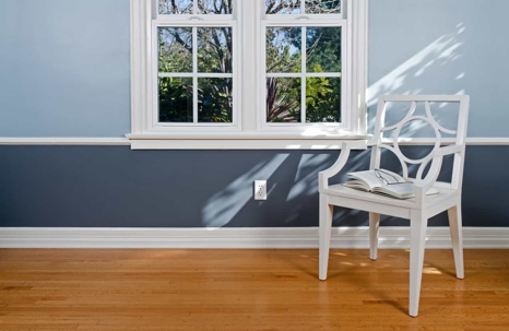 an outlet below a window