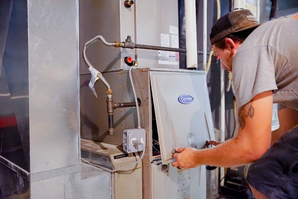 Technician Inspecting Heater